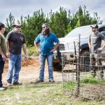 Bill Busbice, Terry Carr, Willie Robertson and Matt Busbice discussing a scene for the TV show “Country Bucks”