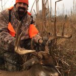 Bill Busbice poses with the largest whitetail he ever killed in Louisiana
