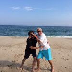 Bill Busbice and his friend Michael Friedman playing on the beach in the Hamptons